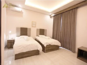 kamar tidur twin Villa Naura Puncak